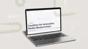 CIMM website homepage design on a laptop