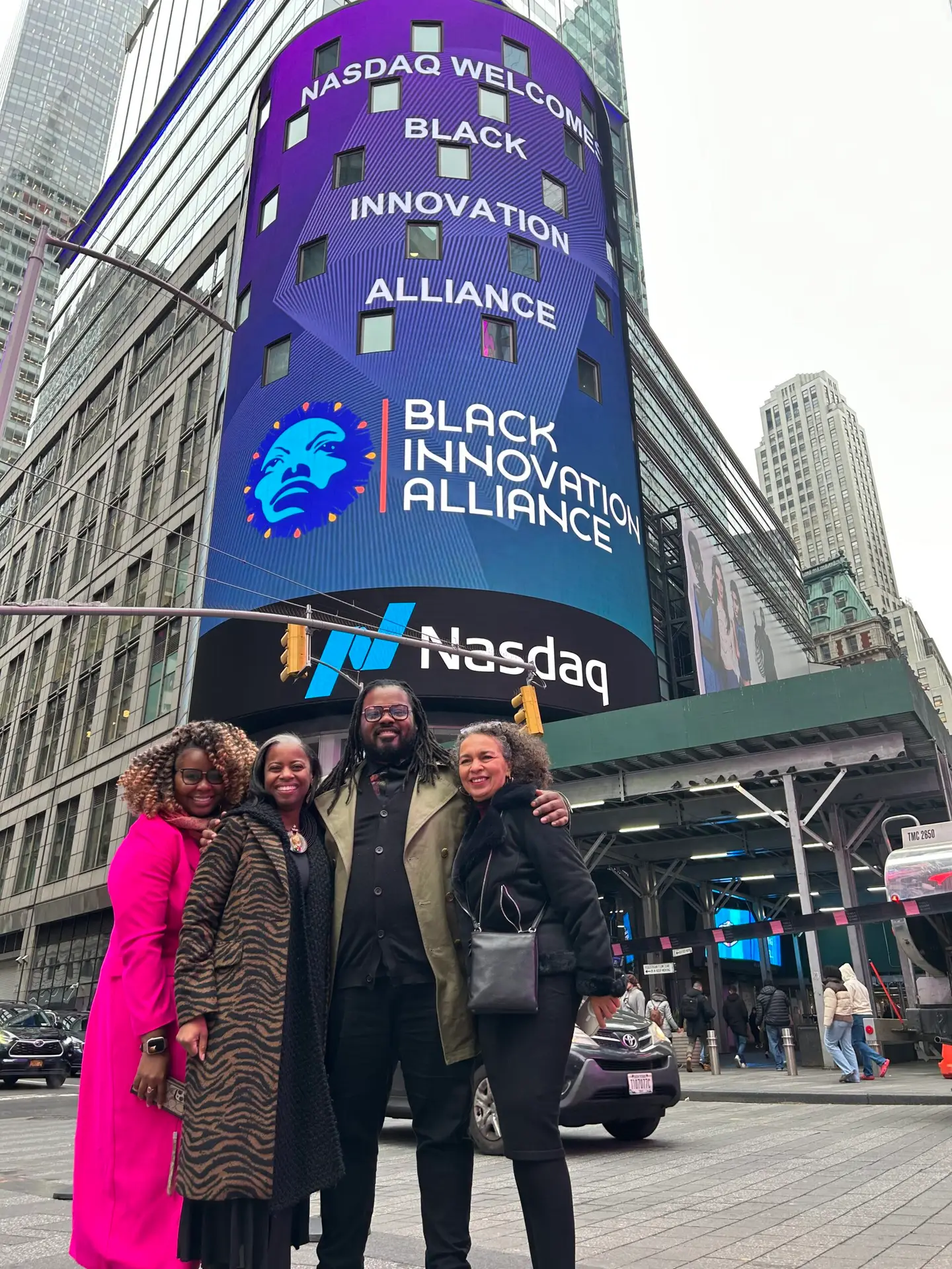 Nasdaq tower in Times Square branded for Black Innovation Alliance with the team below